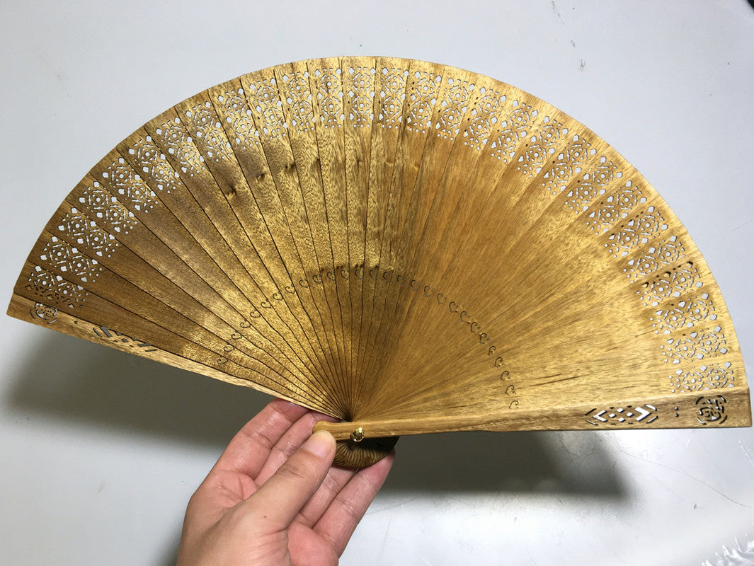 Golden nanmu fan Xiaoye Zhennan old material Su fan Jinsi nan fan hollowed out ancient style traditional solid wood China